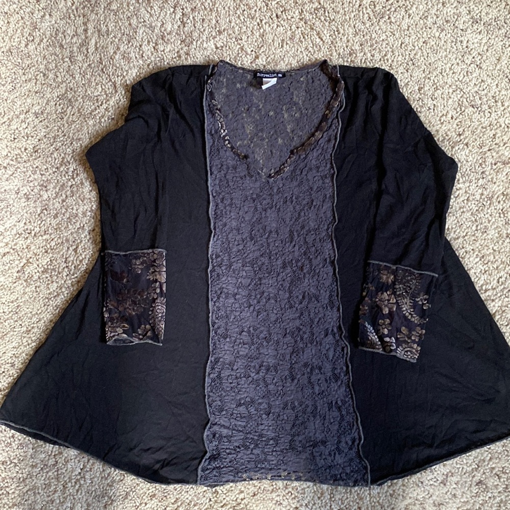 Black tunic, teal lace down center, front and back. Raised velvet flower cuff.